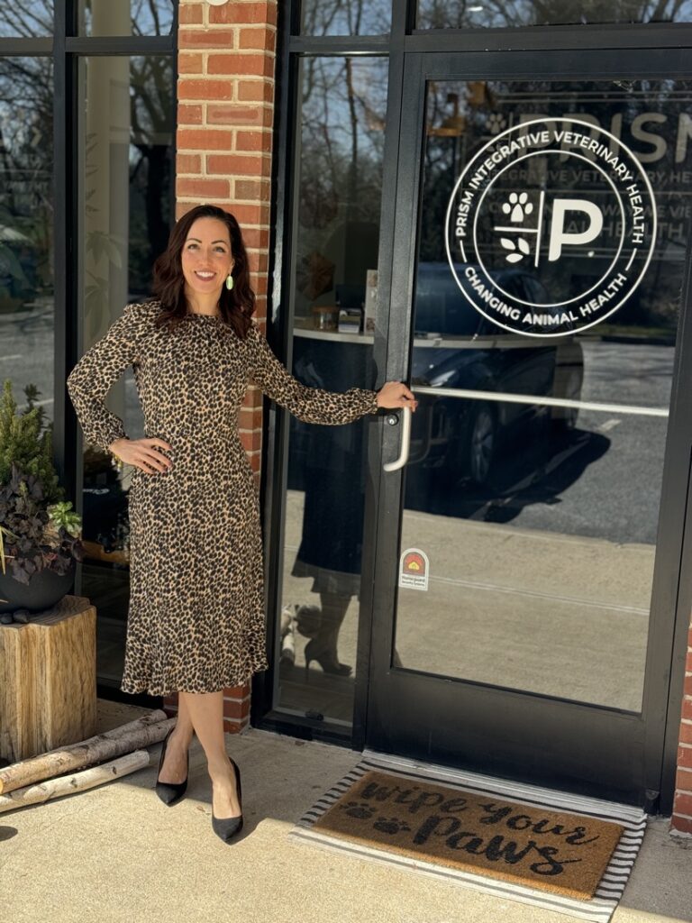 Prism Integrative Veterinary Health owner Dr. Kendra Pope standing outside the clinic in New Jersey, promoting Ozone Therapy for pet health and wellness.